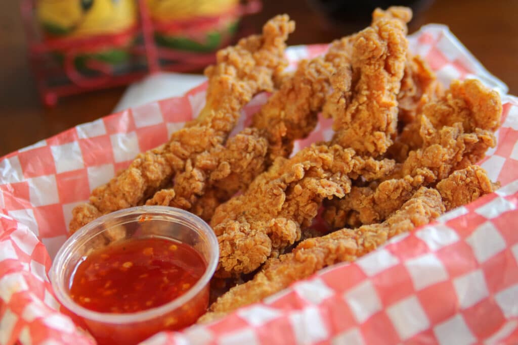 Crispy tender Southern fried chicken breast tenders with chili c