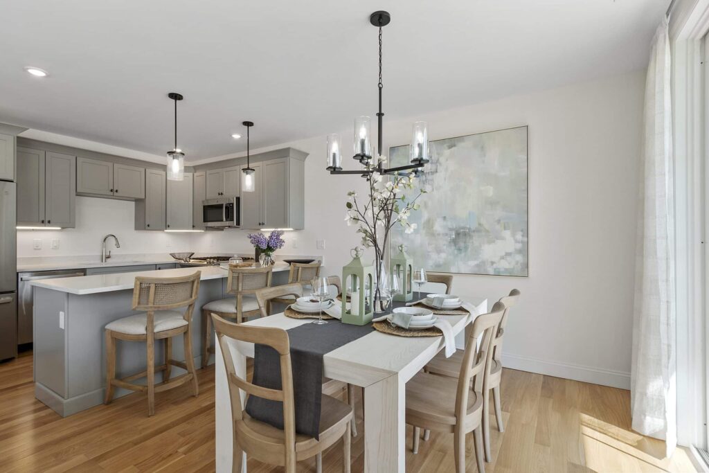 Kitchen and dining area in a South Lake townhome with a pendant chandelier
