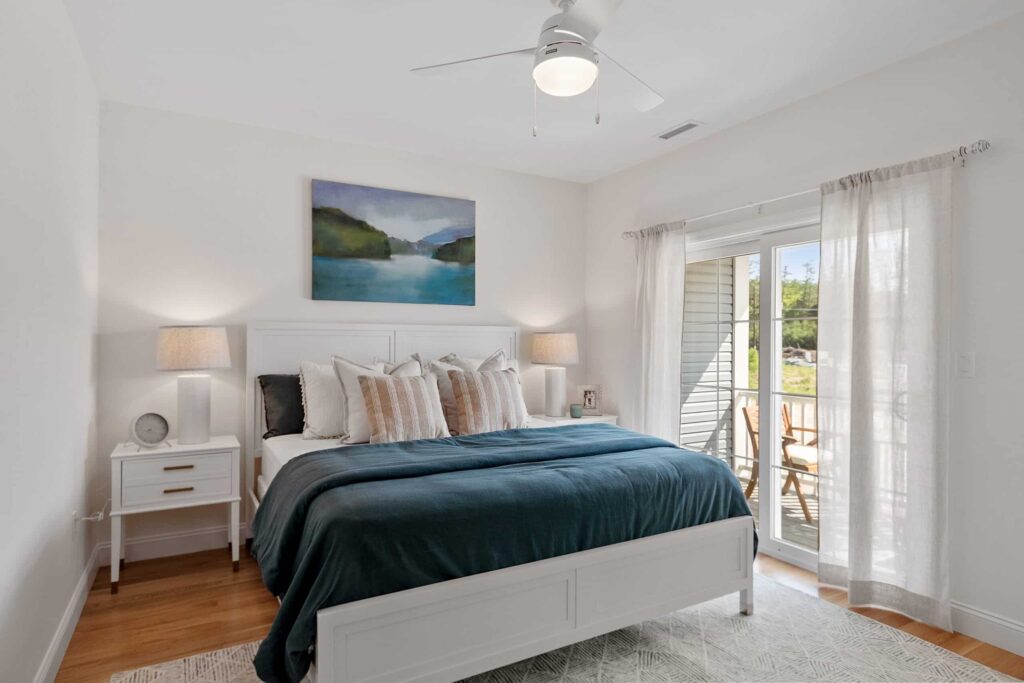 Bedroom in a South Lake townhome with sliding doors to a covered balcony