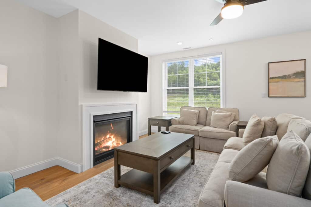 Furnished South Lake living room with a wall-mounted TV and fireplace